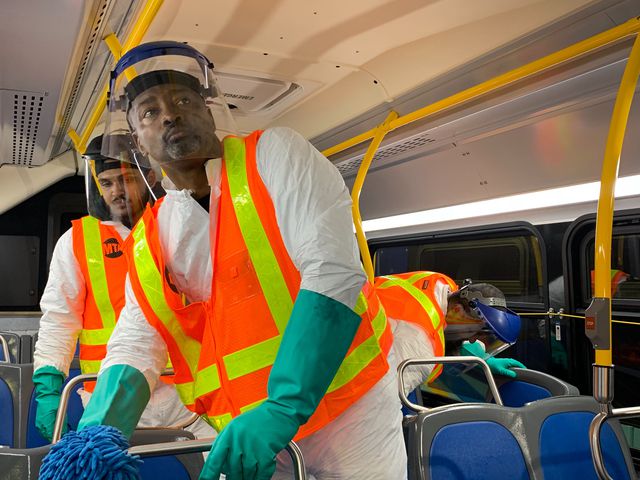 Cleaning crew on a NYC bus
